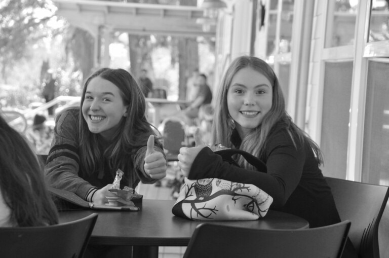 2 girls giving the thumbs up