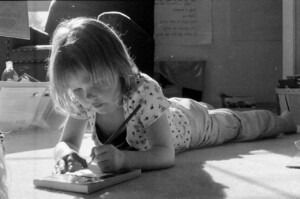 little girl learning in sunlight