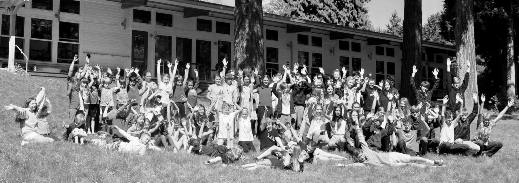 community welcome students in front of Attic building
